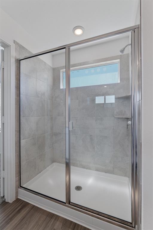 108 Joe Kidd Lane Jarrell, TX 76537 - Photo 16 of 22 a bathroom with a glass shower door