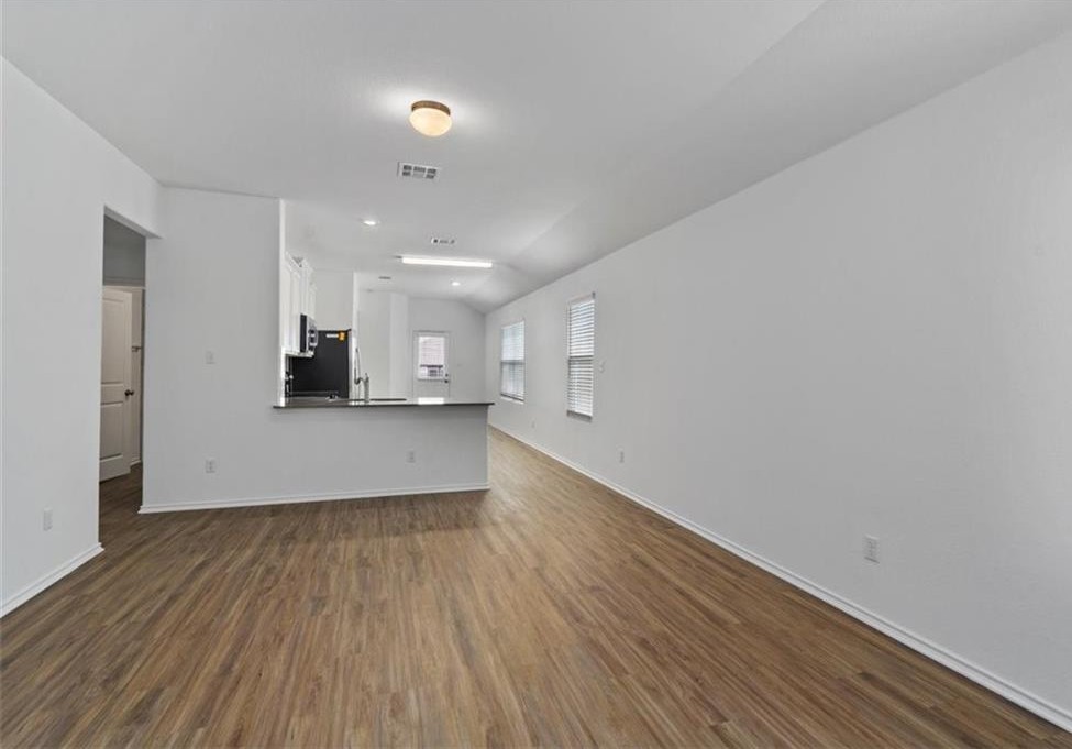 108 Joe Kidd Lane Jarrell, TX 76537 - Photo 3 of 22 a view of kitchen with wooden floor