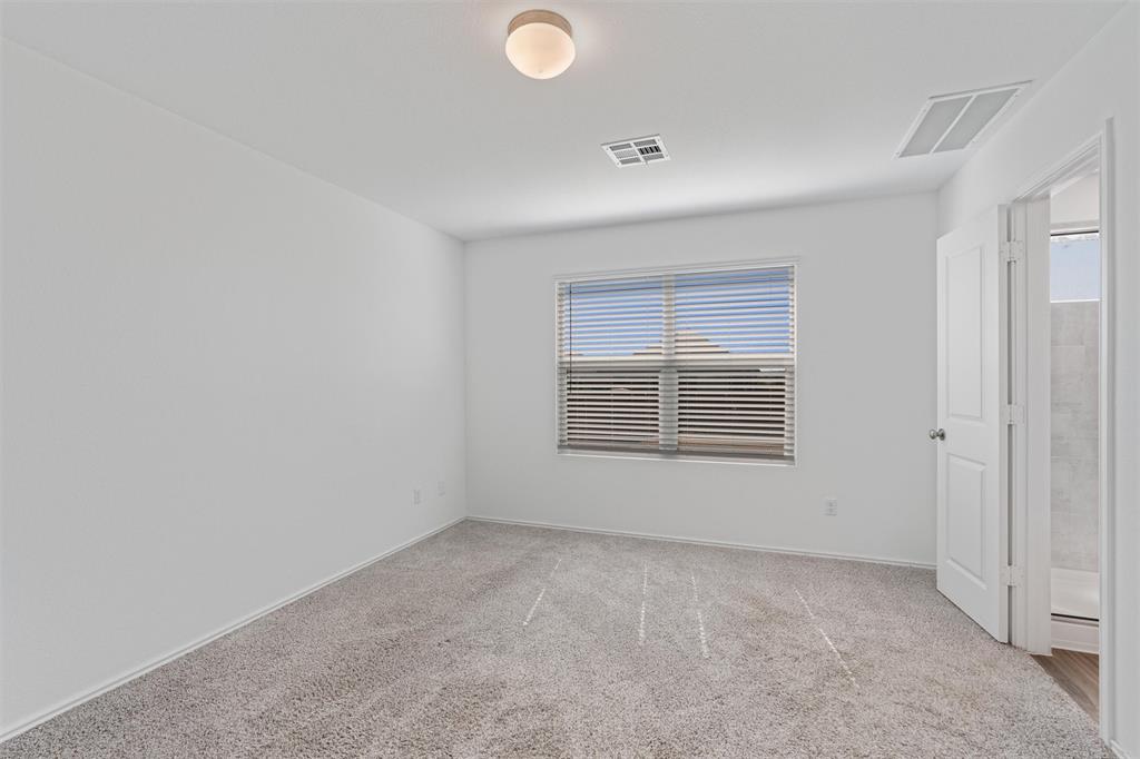 108 Joe Kidd Lane Jarrell, TX 76537 - Photo 8 of 22 a view of an empty room with a window