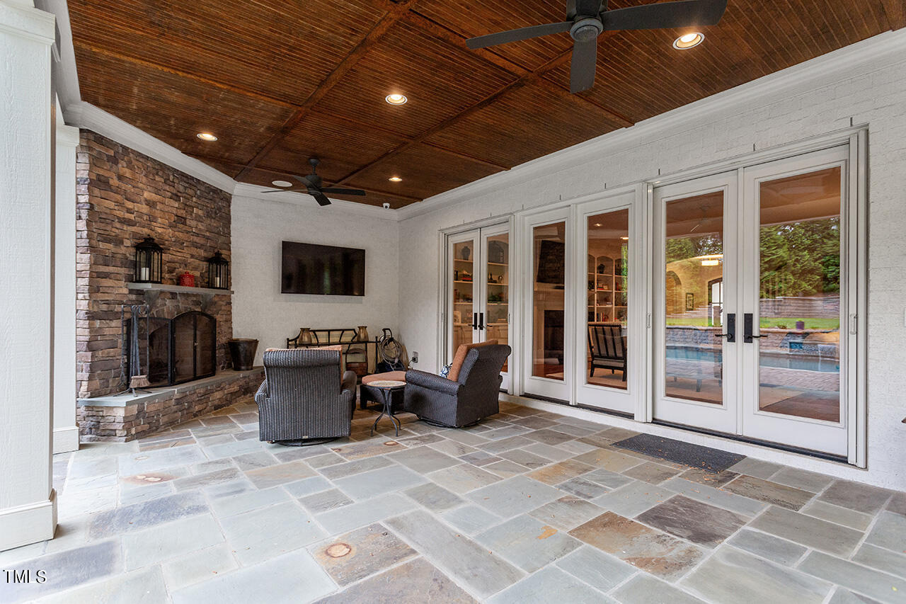 2311 Churchill Road Raleigh, NC 27608 - Photo 16 of 73 a lobby with furniture and a flat screen tv