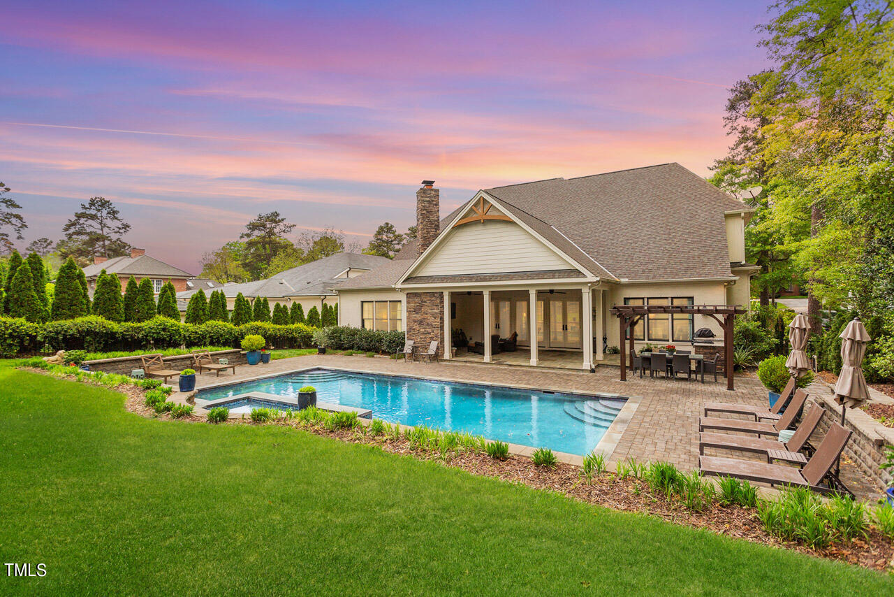 2311 Churchill Road Raleigh, NC 27608 - Photo 24 of 73 a view of a house with a big yard and sitting area