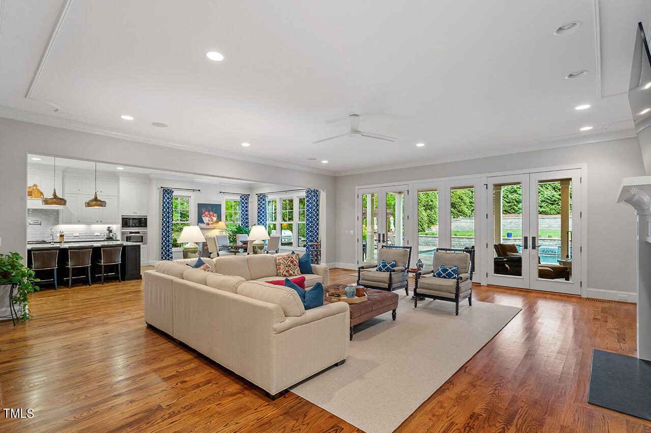 2311 Churchill Road Raleigh, NC 27608 - Photo 25 of 73 a living room with furniture and a large window