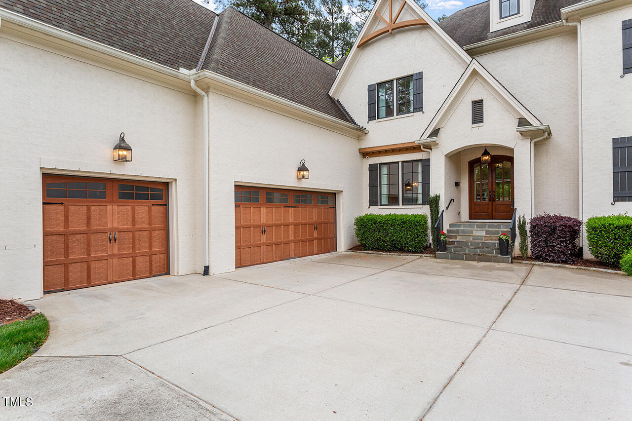 2311 Churchill Road Raleigh, NC 27608 - Photo 5 of 73 a front view of a house with garden