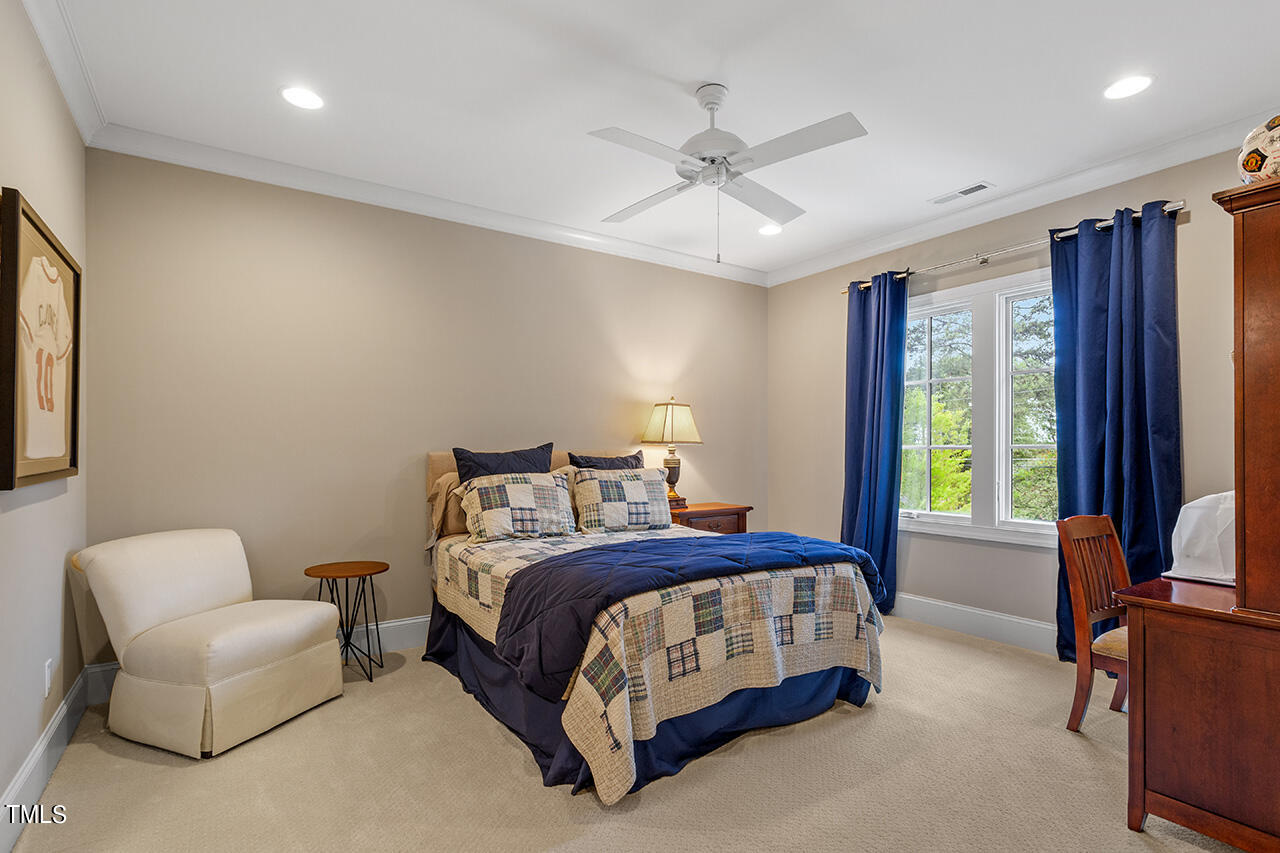 2311 Churchill Road Raleigh, NC 27608 - Photo 58 of 73 a bedroom with a bed couch and window