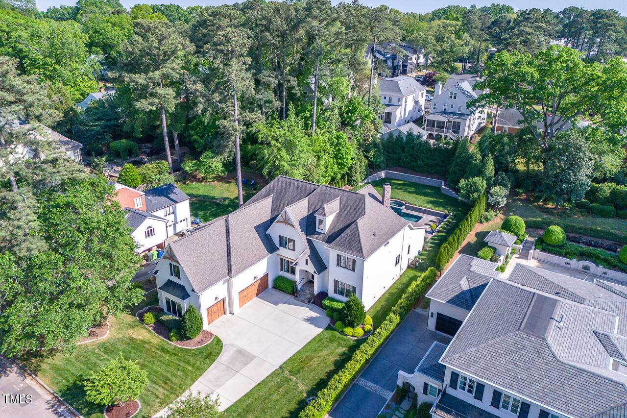 2311 Churchill Road Raleigh, NC 27608 - Photo 64 of 73 an aerial view of a house with garden space and street view