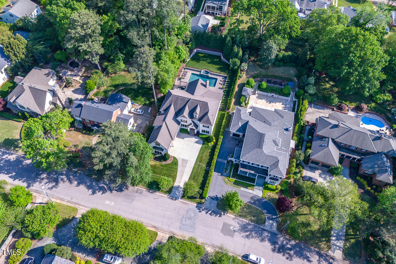 2311 Churchill Road Raleigh, NC 27608 - Photo 68 of 73 an aerial view of a house with a yard and garden