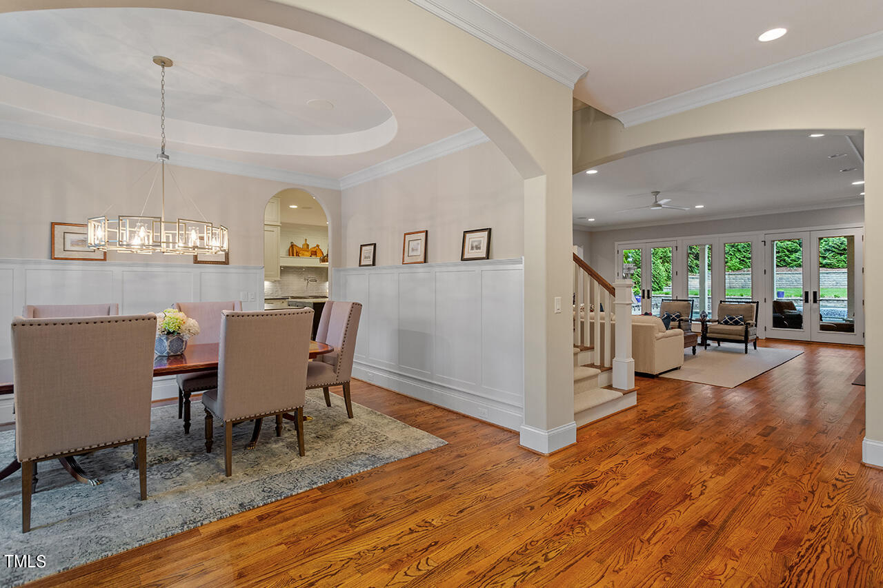 2311 Churchill Road Raleigh, NC 27608 - Photo 7 of 73 a view of a dining room with furniture window and wooden floor