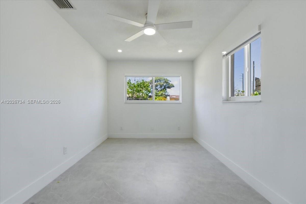 266 Southwest 6th Street Dania Beach, FL 33004 - Photo 16 of 37 an empty room with windows