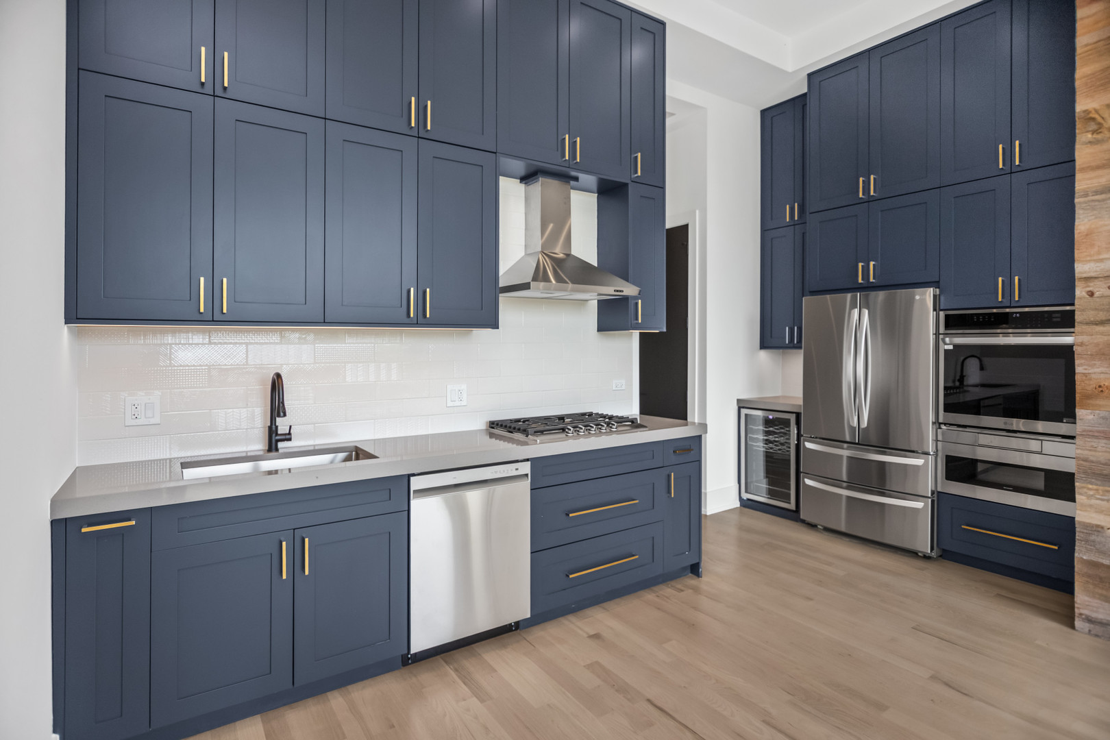 6556 South Minerva Avenue, Unit 2S Chicago, IL 60637 - Photo 6 of 19 a kitchen with a sink cabinets and stainless steel appliances