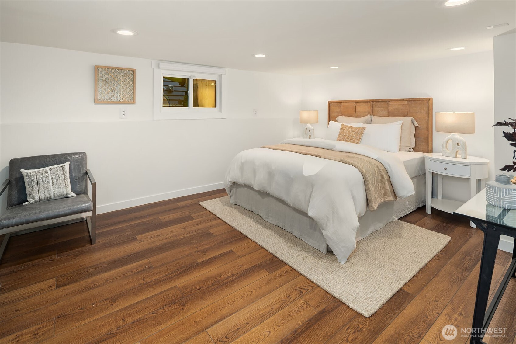 519 27th Avenue Seattle, WA 98122 - Photo 23 of 38 a bedroom with a bed and wooden floor