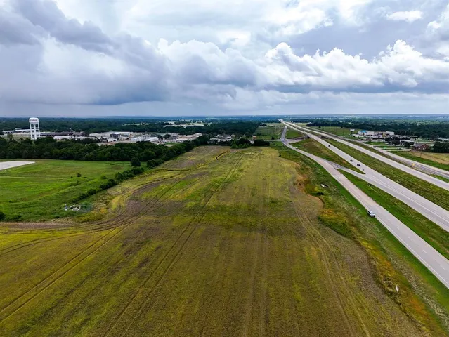 a view of a swimming pool and an outdoor seating