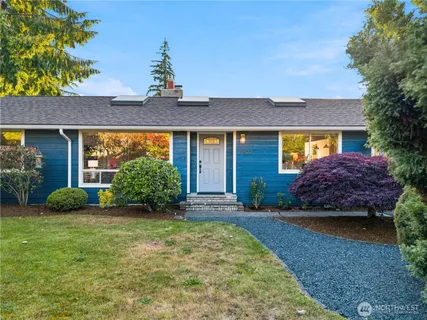 a front view of a house with garden