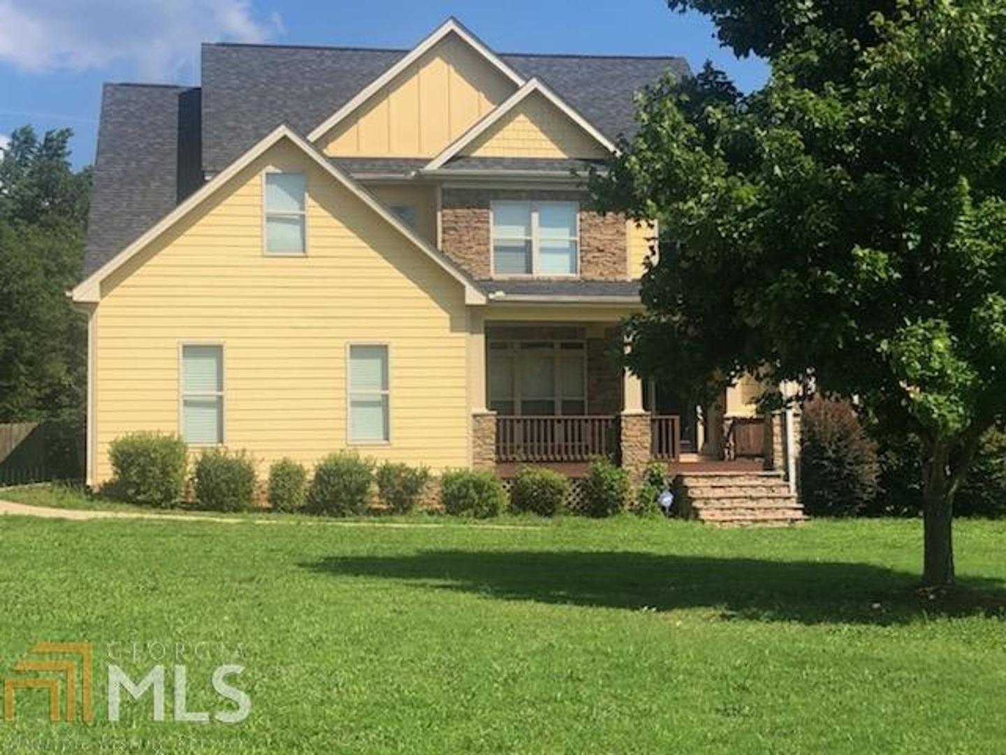 100 Chimney Ridge Lane Covington, GA 30014 - Photo 1 of 1 a front view of a house with a yard