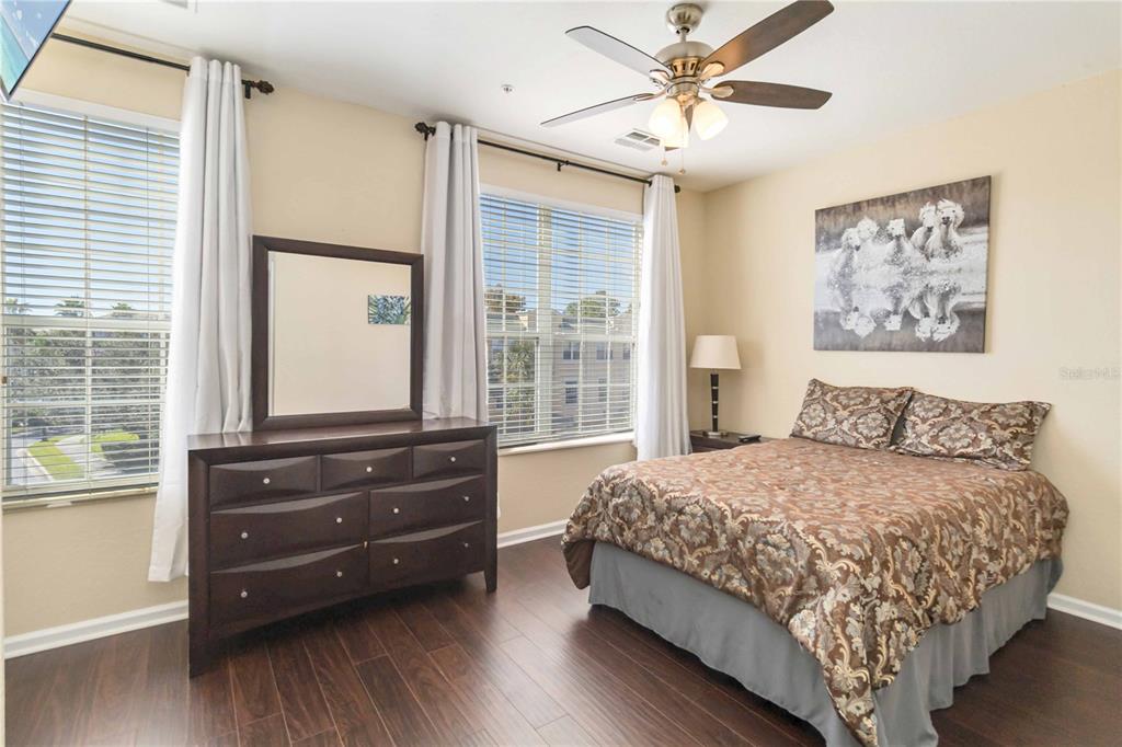5038 Tideview Circle, Unit 26 Orlando, FL 32819 - Photo 18 of 42 a bedroom with a bed and a large window