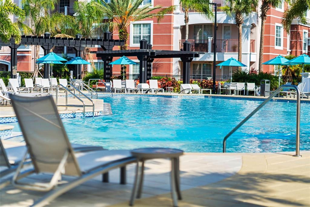 5038 Tideview Circle, Unit 26 Orlando, FL 32819 - Photo 42 of 42 a view of swimming pool with outdoor seating and a patio