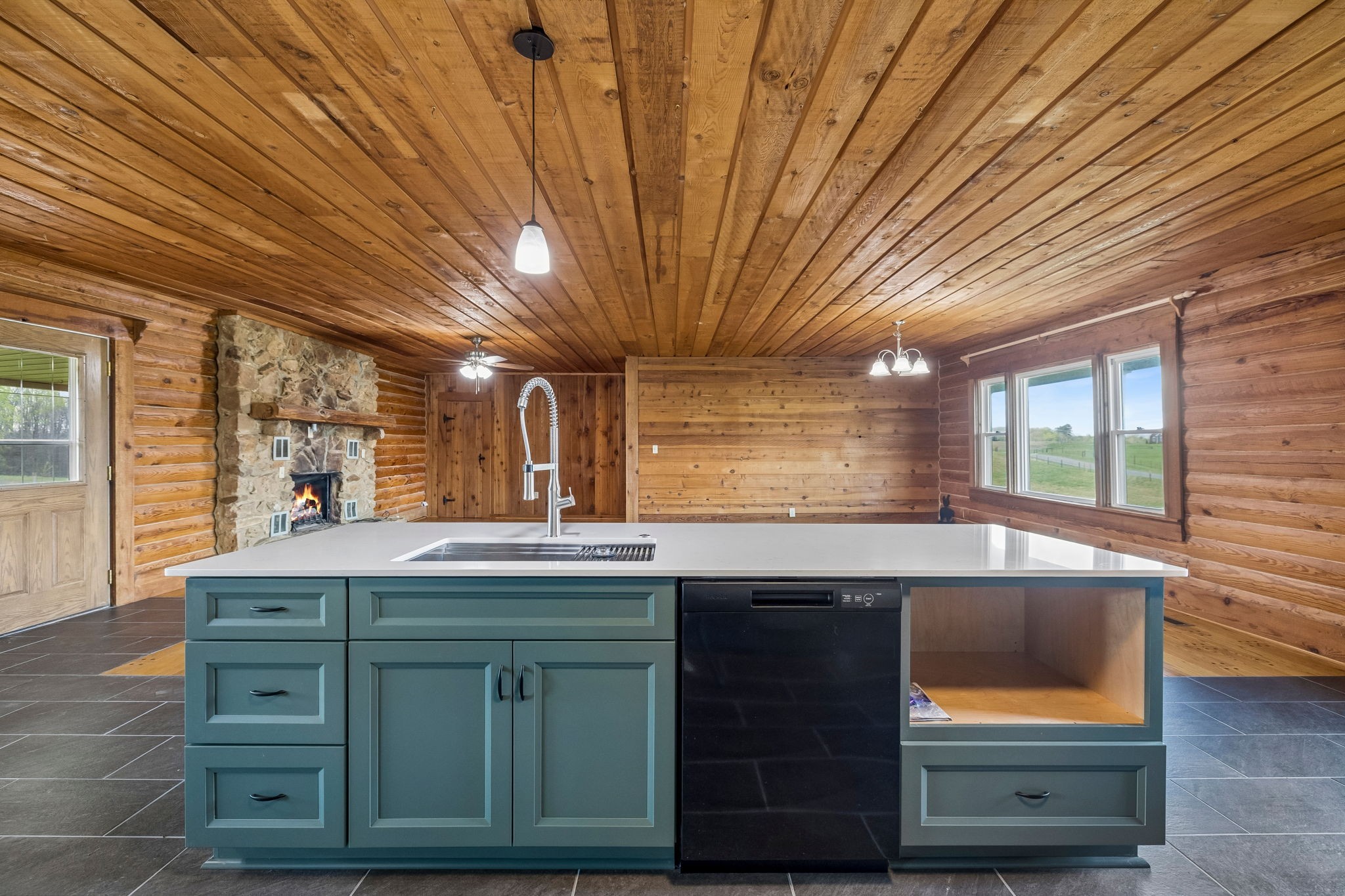 901 Town Branch Road Charlotte, TN 37036 - Photo 57 of 87 a kitchen with kitchen island a sink and wooden floors