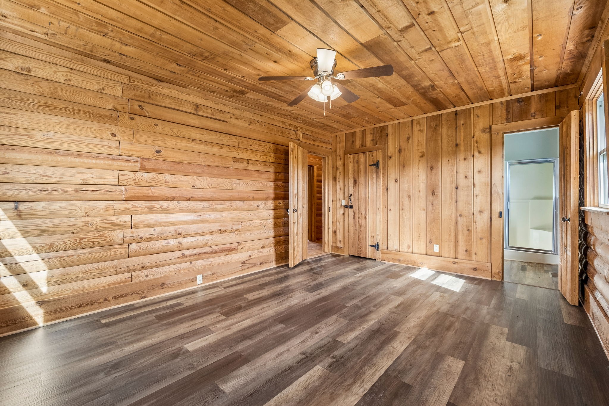 901 Town Branch Road Charlotte, TN 37036 - Photo 62 of 87 a view of a room with wooden floor and door