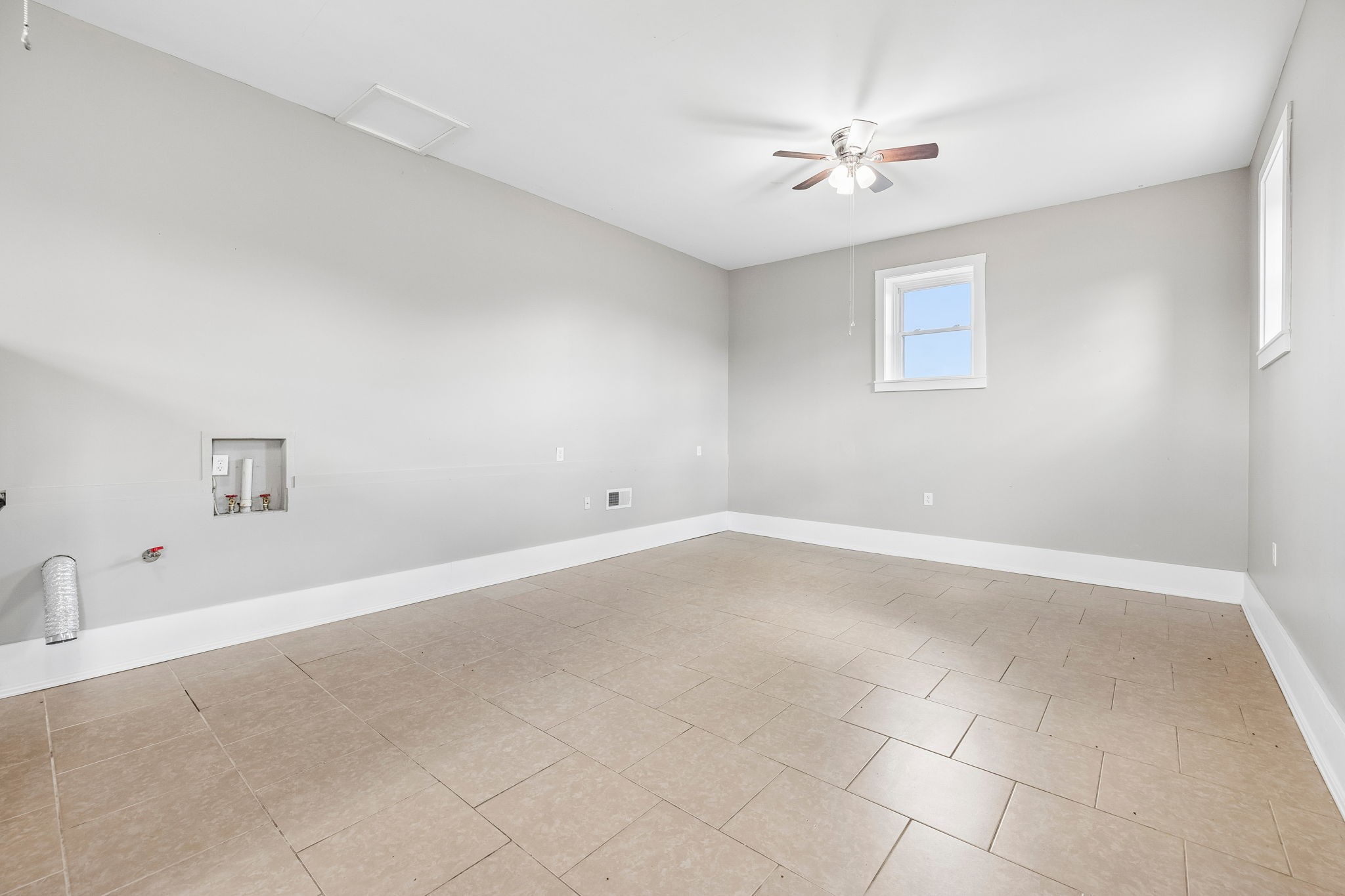 901 Town Branch Road Charlotte, TN 37036 - Photo 64 of 87 an empty room with a ceiling fan and window