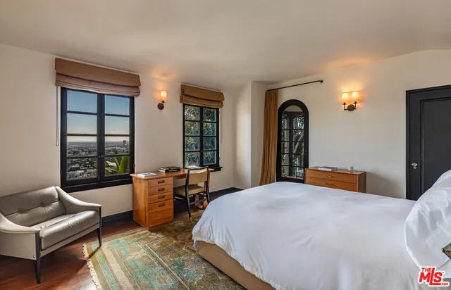 a view of a balcony with furniture