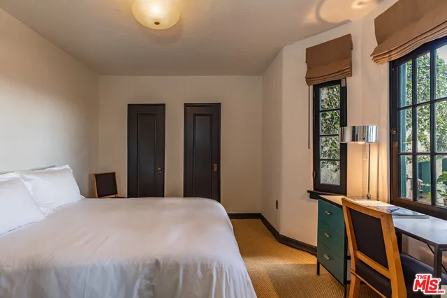 a area with wooden floor and furniture