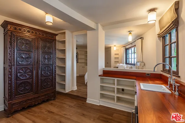 a kitchen with a sink and cabinets