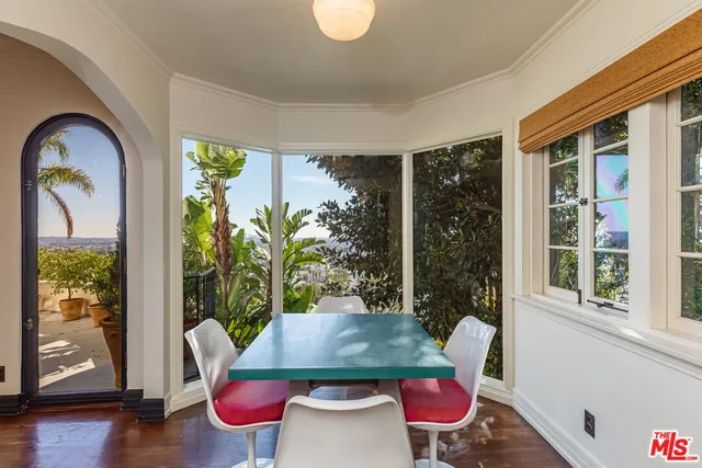 a kitchen with a stove a sink and a refrigerator