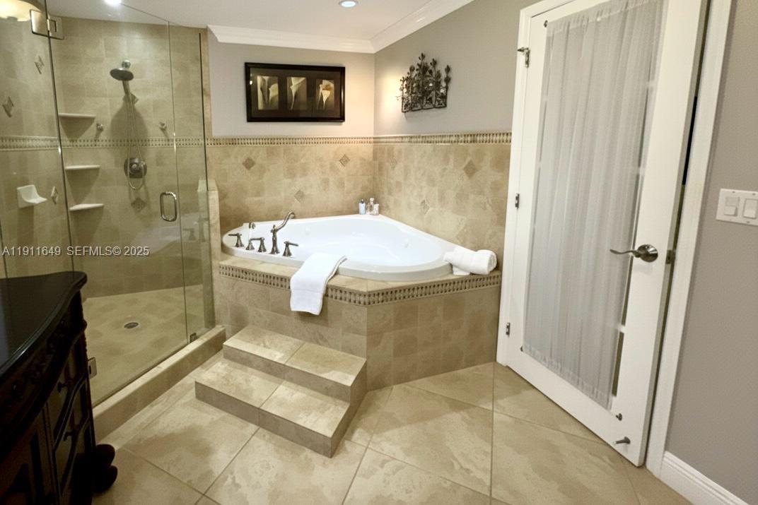 6905 Southwest 148th Court Miami, FL 33193 - Photo 15 of 26 a bathroom with a sink mirror and shower