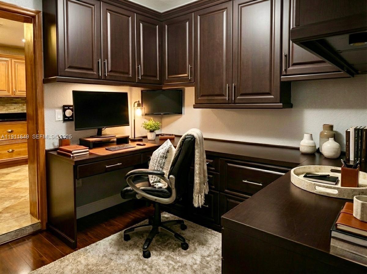 6905 Southwest 148th Court Miami, FL 33193 - Photo 22 of 26 a kitchen with a stove and a microwave