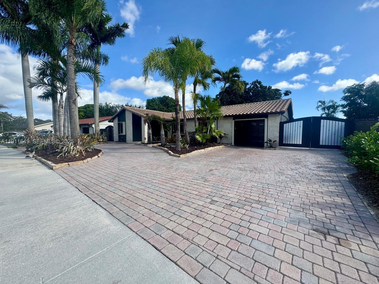6905 Southwest 148th Court Miami, FL 33193 - Photo 3 of 26 a view of a house with a patio