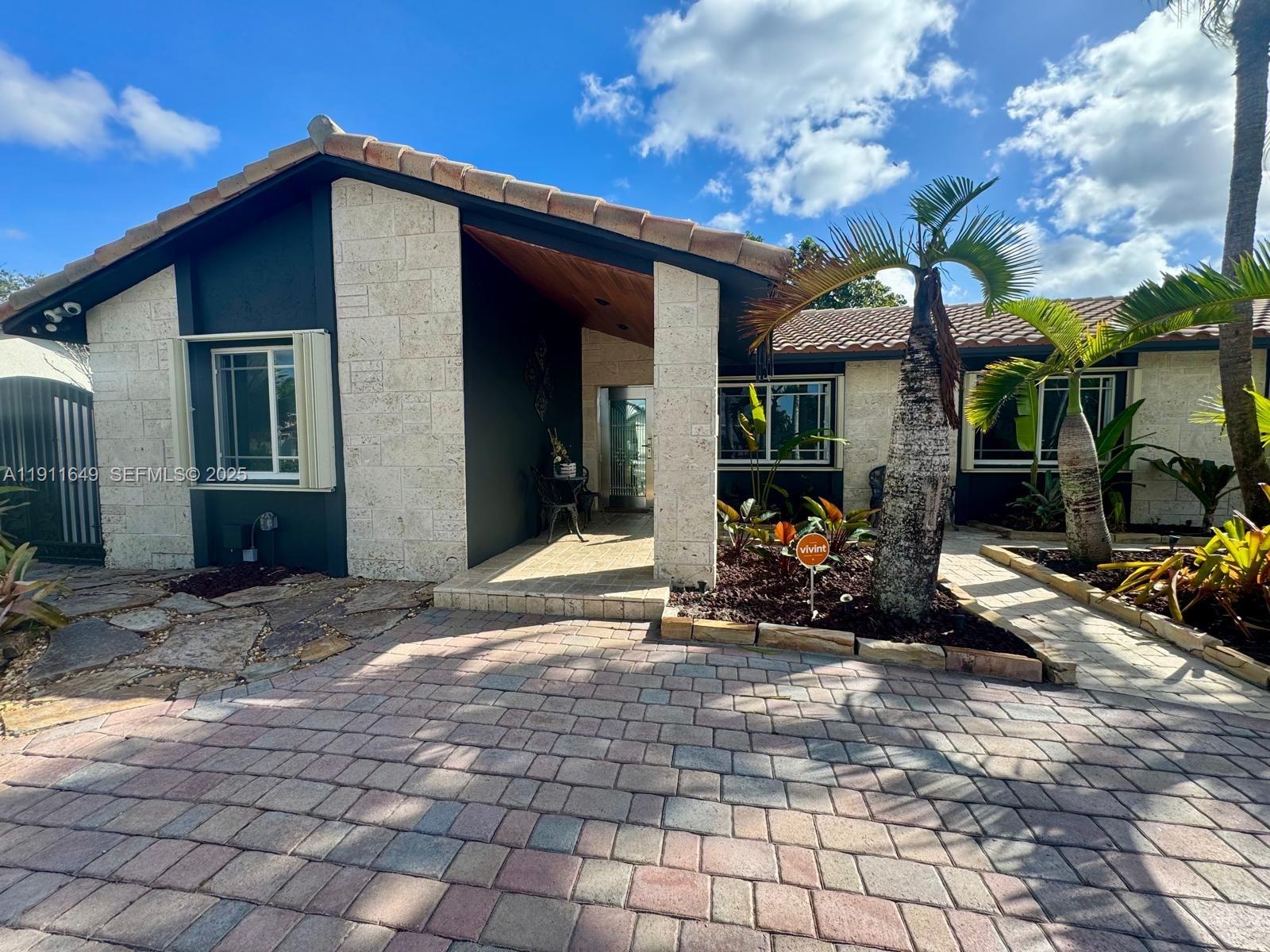6905 Southwest 148th Court Miami, FL 33193 - Photo 5 of 26 a view of a house with patio