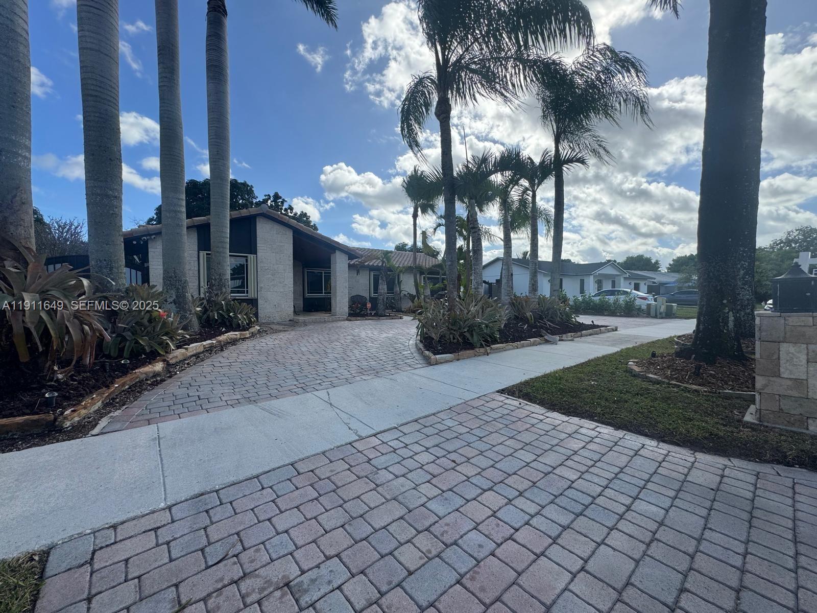 6905 Southwest 148th Court Miami, FL 33193 - Photo 7 of 26 a view of a pathway along the building