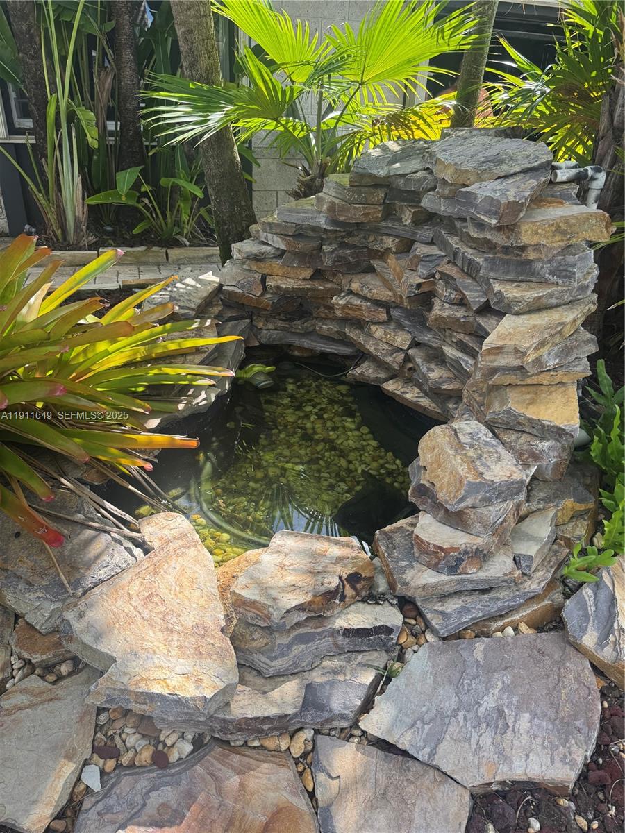 6905 Southwest 148th Court Miami, FL 33193 - Photo 8 of 26 a view of a fire pit with some chair