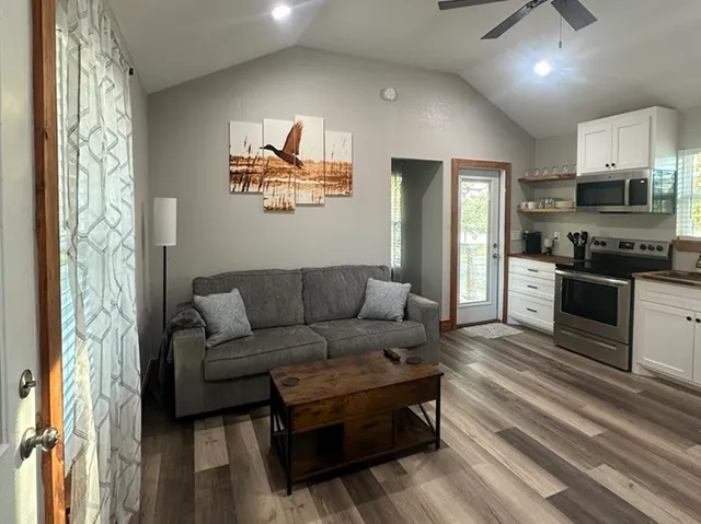 a view of a kitchen with a sink and microwave