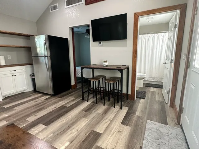 a kitchen with appliances cabinets and a window