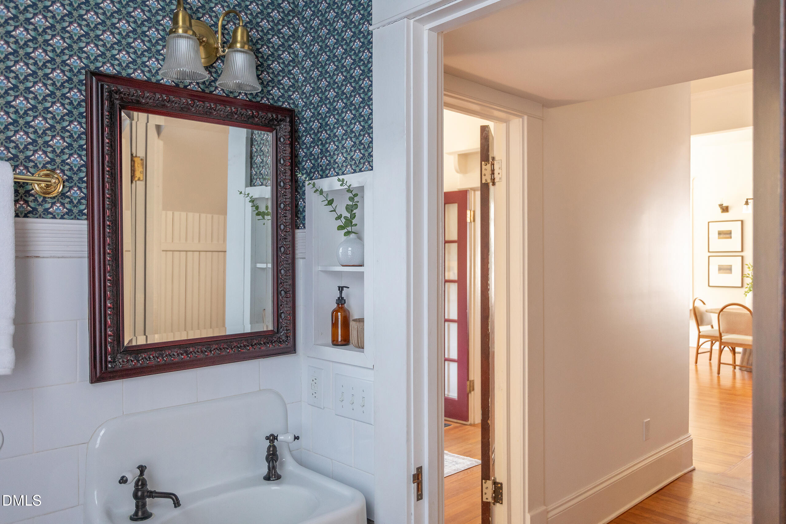 127 Forest Road Raleigh, NC 27605 - Photo 35 of 75 a bathroom with a sink and a mirror
