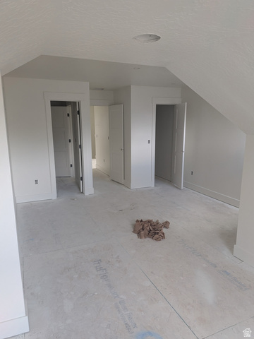 2771 West Aurora Avenue Mapleton, UT 84664 - Photo 25 of 39 Unfinished flooring, multiple doorways, a vaulted ceiling, and recessed lighting