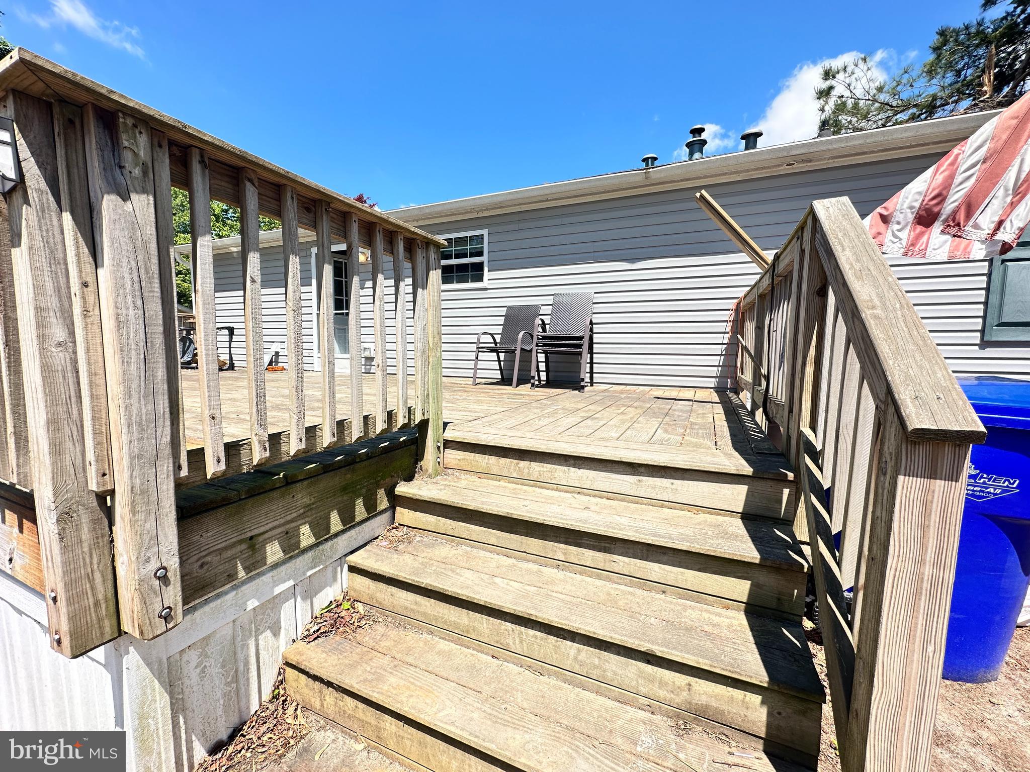 35390 Heron Road Millsboro, DE 19966 - Photo 20 of 25 a view of wooden balcony with chairs