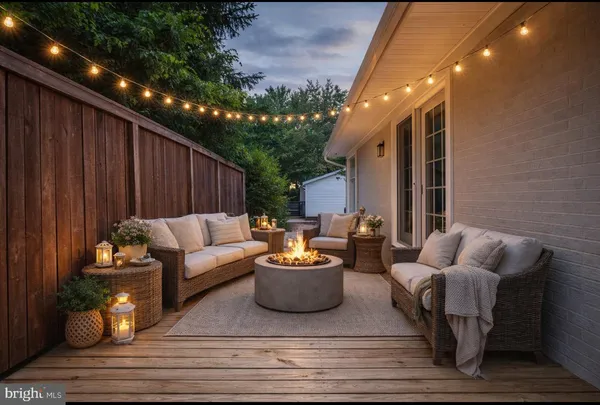 a kitchen with stainless steel appliances granite countertop a refrigerator a sink dishwasher a stove and white cabinets with wooden floor