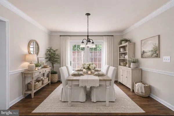 a living room with furniture potted plant and a window