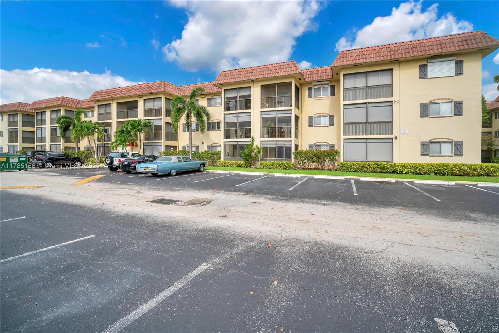 257 South Cypress Road, Unit 416 Pompano Beach, FL 33060 - Photo 7 of 11 a view of a building with a street