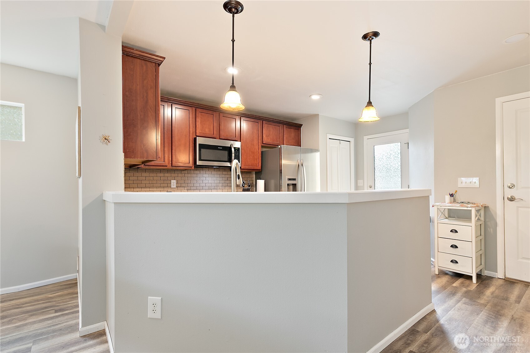 6600 Indiana Street Southeast Lacey, WA 98513 - Photo 8 of 21 a kitchen with stainless steel appliances granite countertop a refrigerator a oven and a wooden floors