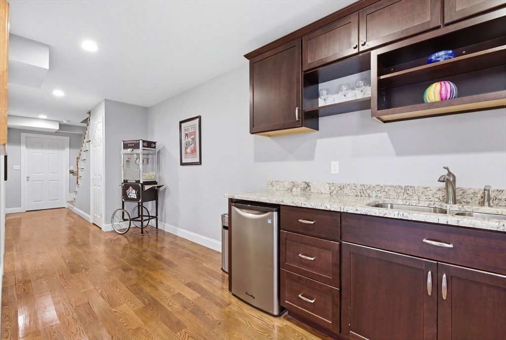 419 Main Street Boston, MA 02129 - Photo 31 of 41 a kitchen with granite countertop a cabinets and wooden floor