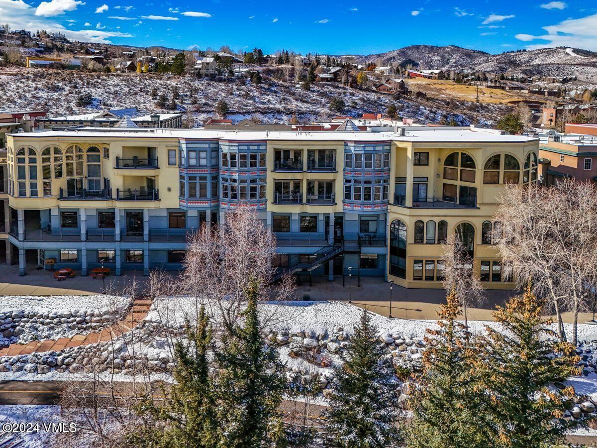 137 Main Street, Unit R203 Edwards, CO 81632 - Photo 15 of 39 an outdoor view of a house with a yard