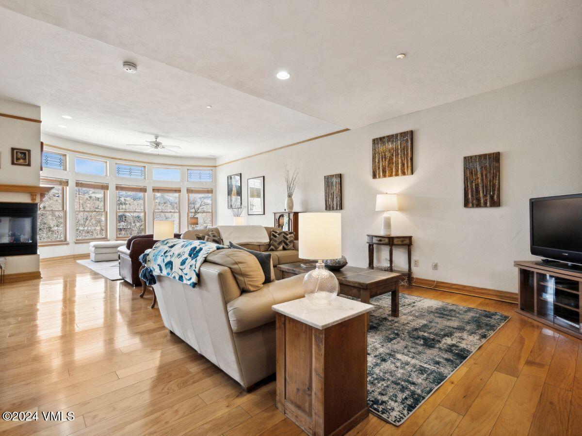 137 Main Street, Unit R203 Edwards, CO 81632 - Photo 3 of 39 a living room with fireplace furniture and a flat screen tv