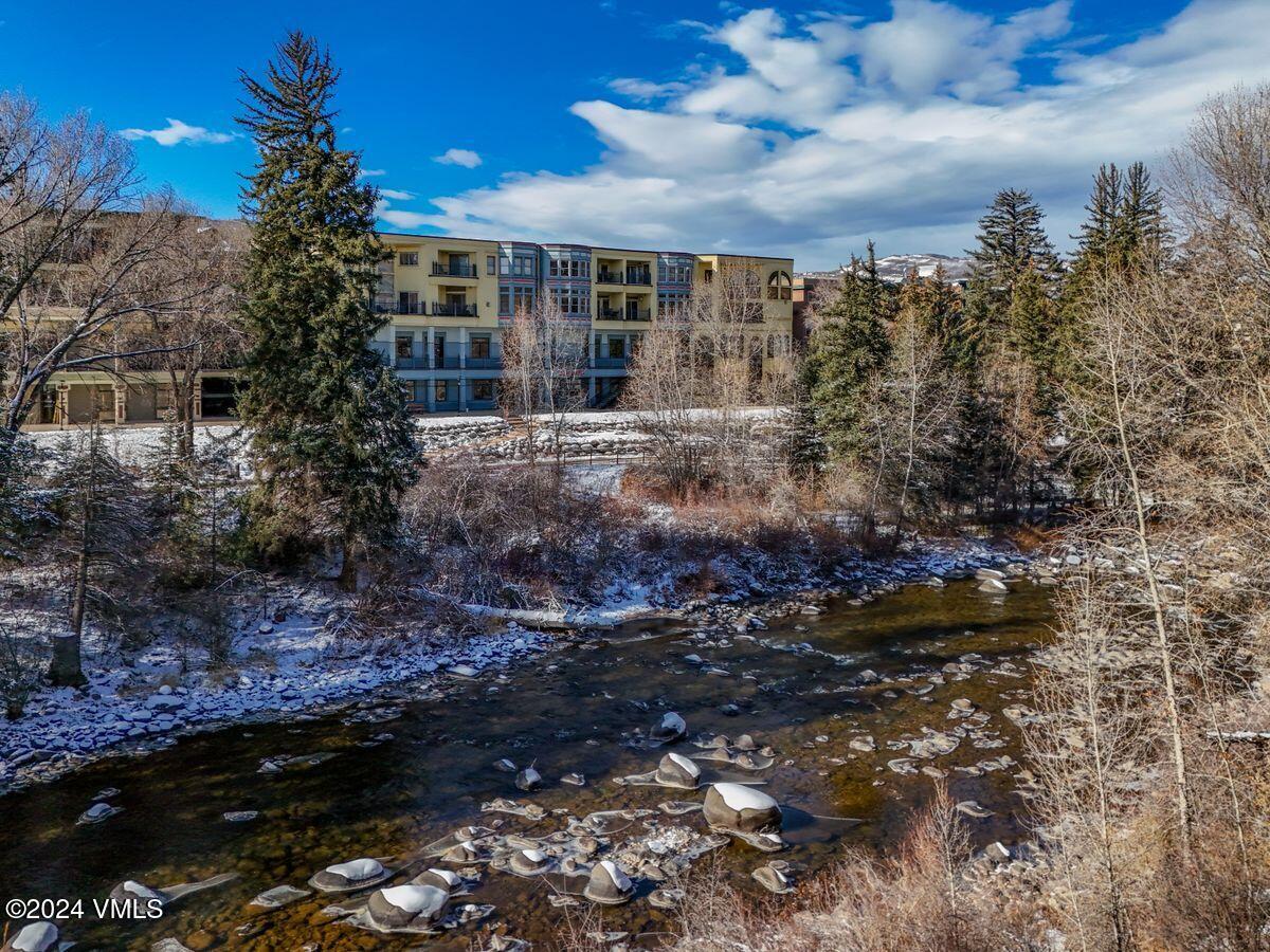 137 Main Street, Unit R203 Edwards, CO 81632 - Photo 37 of 39 a view of a house with a yard and tree s