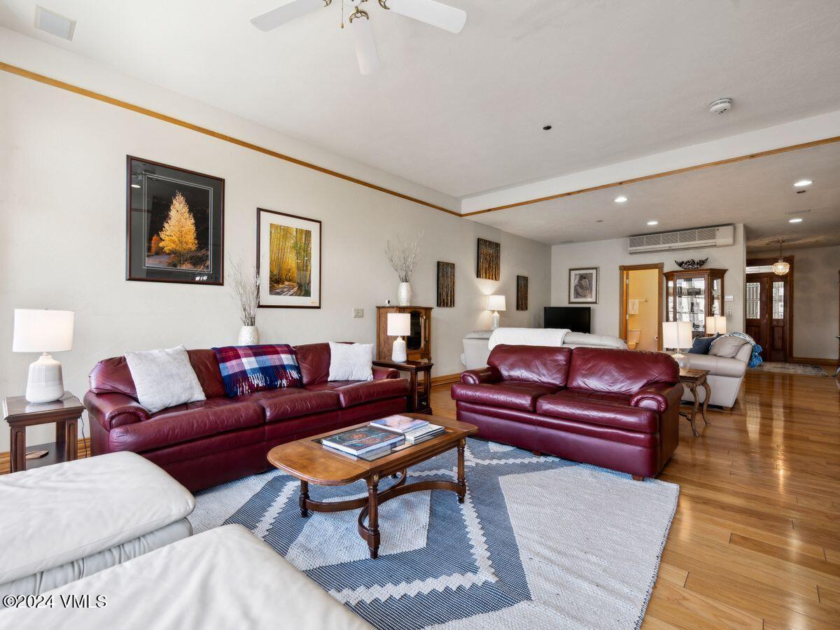 137 Main Street, Unit R203 Edwards, CO 81632 - Photo 7 of 39 a living room with furniture a rug and a painting