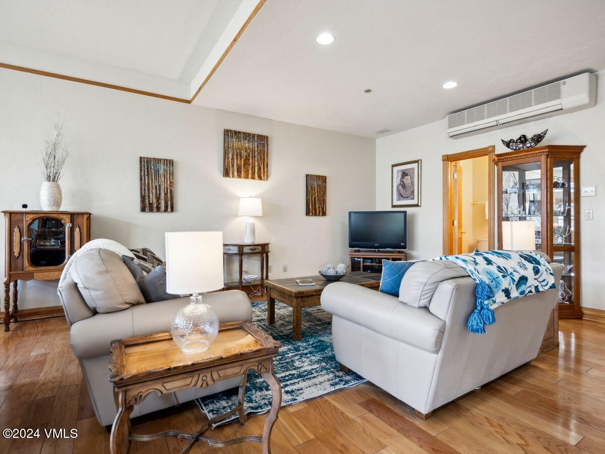 137 Main Street, Unit R203 Edwards, CO 81632 - Photo 8 of 39 a living room with furniture and a flat screen tv