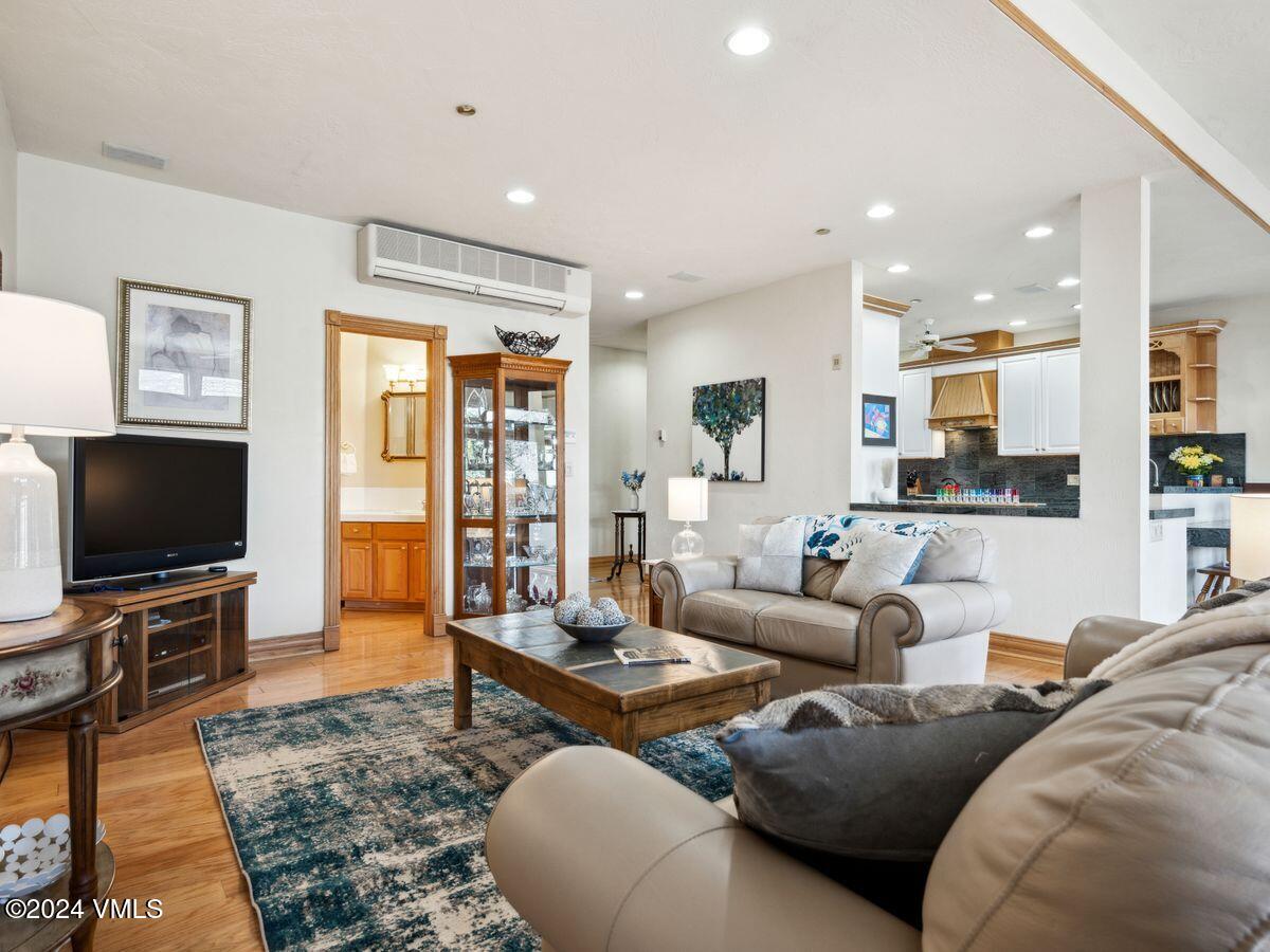 137 Main Street, Unit R203 Edwards, CO 81632 - Photo 10 of 39 a living room with furniture and a flat screen tv