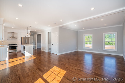 953 High Road Berlin, CT 06037 - Photo 14 of 32 an empty room with wooden floor and windows