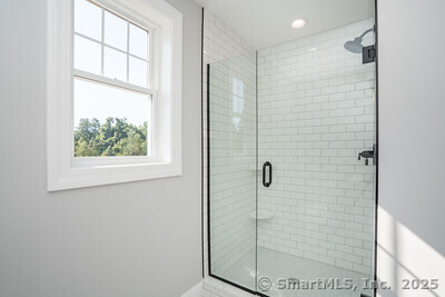 953 High Road Berlin, CT 06037 - Photo 21 of 32 a bathroom with a shower and a window